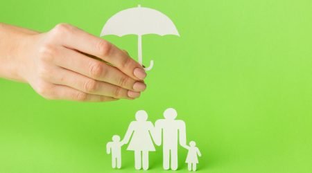 close-up-hand-with-paper-cut-family-concept